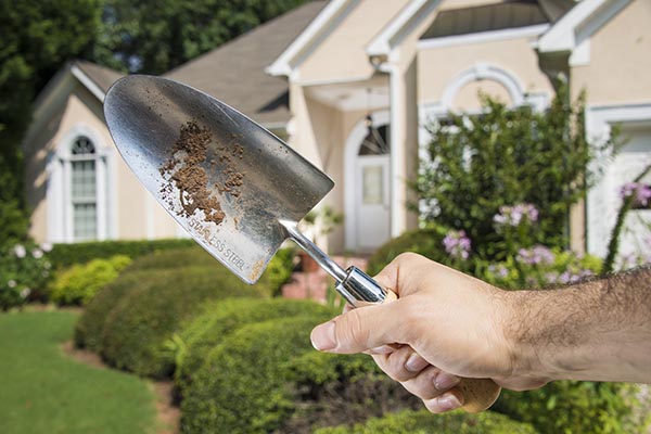 Exterior Home with Handyman and tools belt